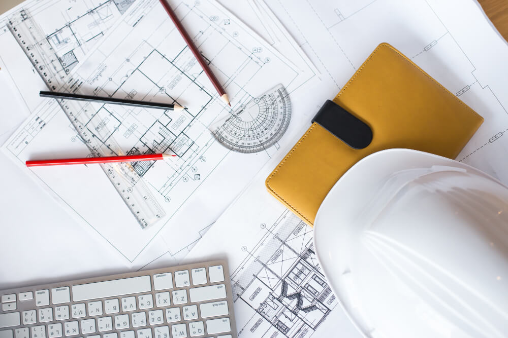 image blueprints with level pencil hard hat table 1 - انجام پروژه عمران
